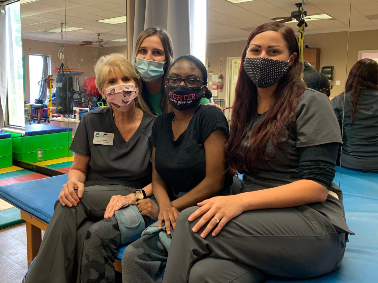 therapists sit with patient