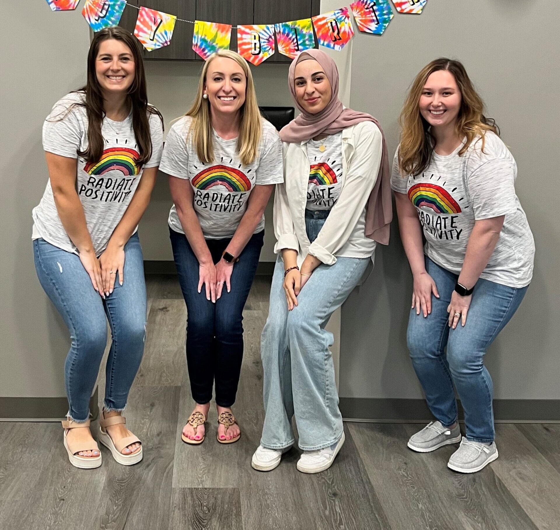 Cole Pediatric Therapy (Cary, NC) team of therapists beam in their “Radiate Positivity” tees in celebration of Disability Pride Month